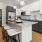 a kitchen with a marble island