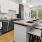 Kitchen with stone countertops and stainless appliances at The Grace at Tryon, the best apartments in Charlotte