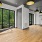 a room with a wood floor and a window