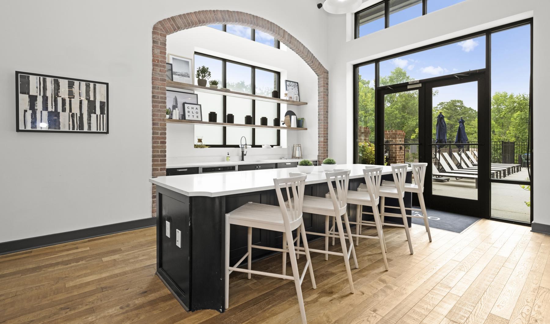 Kitchen with island and barstools at The Grace at Tryon Charlotte apartments for rent