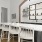 a kitchen with a bar and chairs