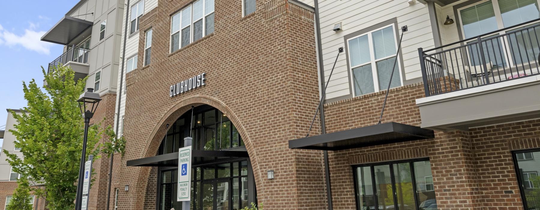 Exterior view of the Clubhouse at The Grace at Tryon apartments near the light rail in Charlotte, NC