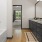 a bathroom with a tub sink and a mirror